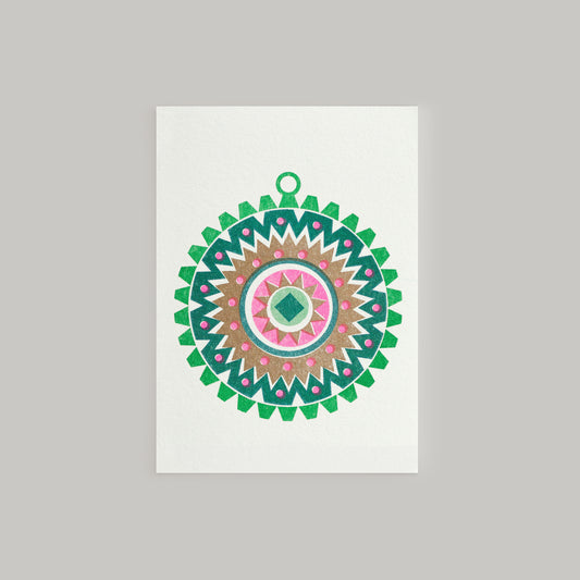 A Scandi style mini Christmas greeting card featuring a geometric pattern with bright pink and metallic gold inks, and a small Christmas tree ornament design in the center. The card has a white background and a contrasting envelope.