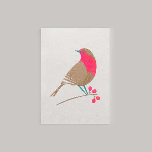 Retro inspired mini Christmas card with festive robin design and envelope risograph printed in gold and bright pink inks.